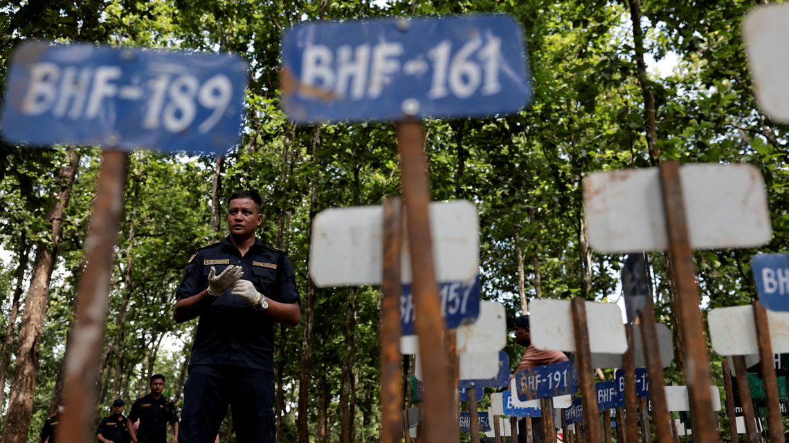 Nepal begins mass burials of unidentified flood victims as families seek missing 