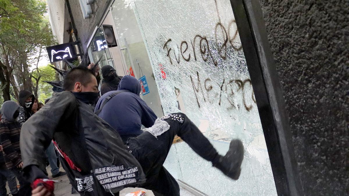 Demonstrators vandalize a retail store during a protest against gentrification in Mexico City on July 4, 2025. The protesters cited rising housing costs and the displacement of long-time Mexican residents from areas of the city that have received large numbers of foreigners. (Silvana Flores/AFP/Getty Images/TNS)