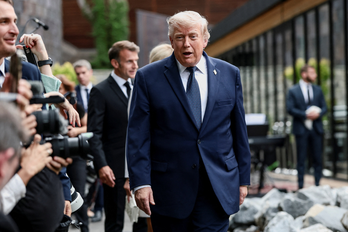 U.S. President Donald Trump walks into a cultural performance and concert during the G7 summit, in Evian-les-Bains, France, June 16, 2026. REUTERS/Evelyn Hockstein