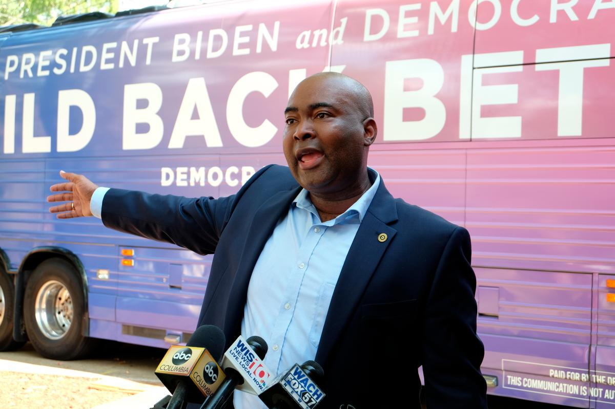 FILE - Democratic National Committee Chair Jaime Harrison speaks with reporters outside the South Carolina Democratic Party headquarters in Columbia, S.C., Aug. 13, 2021.