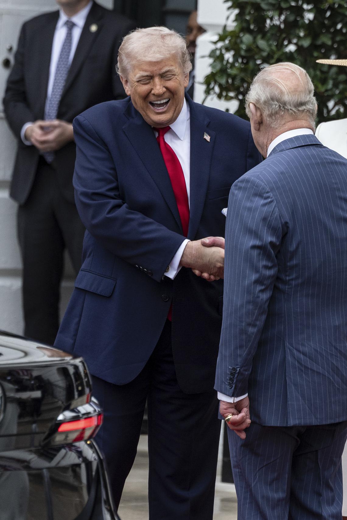President Donald Trump shakes hands with King Charles III as he and first lady Melania Trump greet him during an arrival ceremony on the South Lawn of the White House in Washington, on Tuesday, April 28, 2026. (Anna Rose Layden/The New York Times)