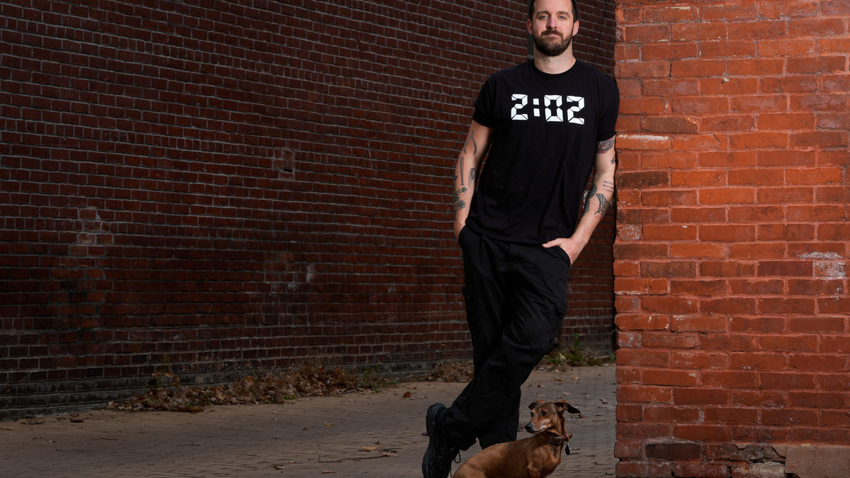 Sam O'Hara is photographed in Washington, D.C., along with his dog Lincoln, on Nov. 7, 2025. O'Hara filed a lawsuit on Oct. 23 against a member of the Ohio National Guard and several police officers after being detained at a September protest in the nation's capital while playing a well-known villain theme song from the "Star Wars" movies.