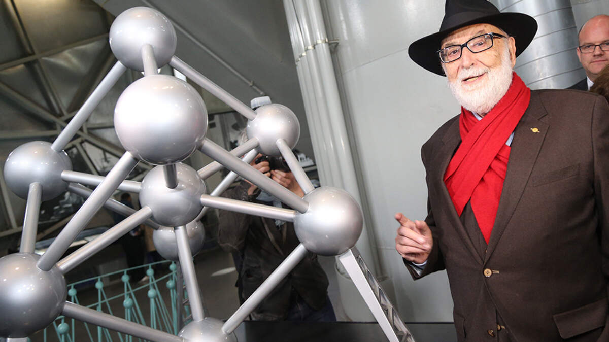 Belgian physicist and Nobel Prize winner Francois Englert poses for a photograph during an event marking the creation of an ”atomium” in Brussels on April 28, 2014. Englert, whose work helped lead to the discovery of the Higgs boson, known as the “God Particle,” and shared half of the 2013 Nobel Prize for Physics with British theoretical physicist Peter Higgs, died on June 18. He was 93.