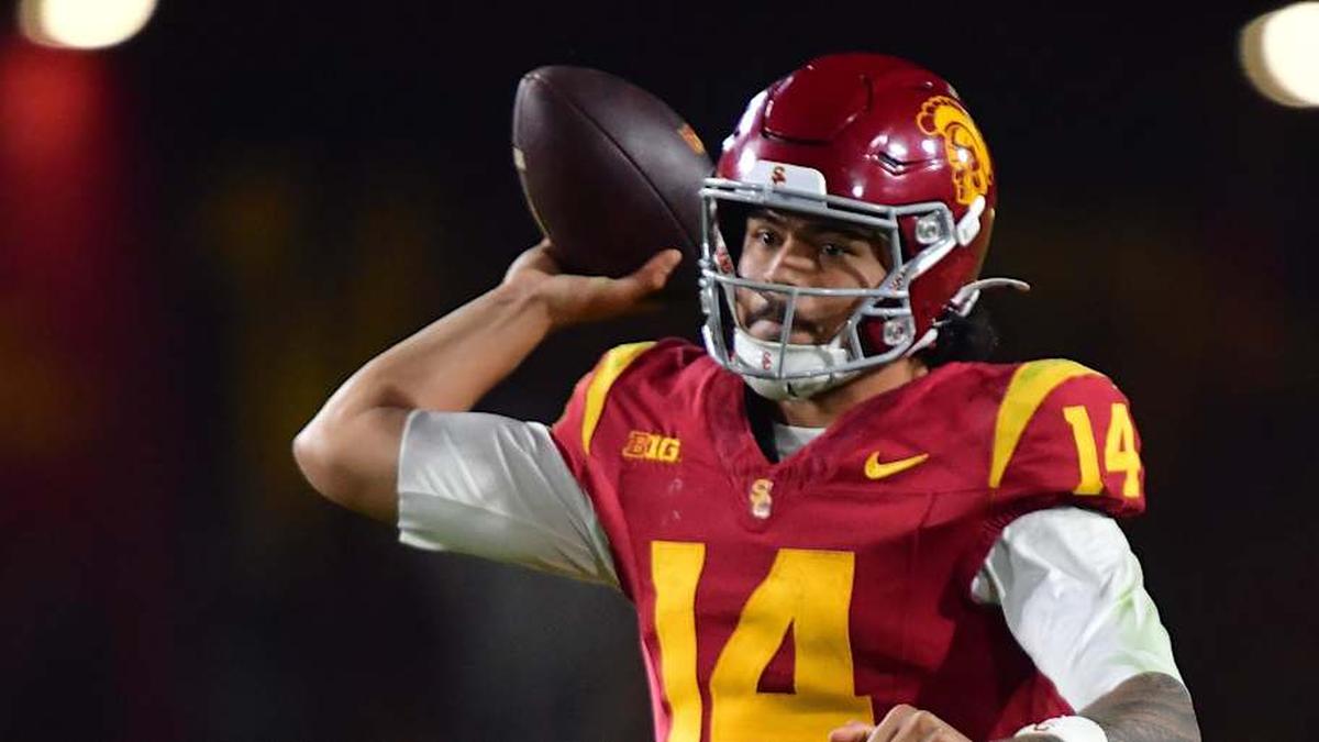 Nov 7, 2025; Los Angeles, California, USA; Southern California Trojans quarterback Jayden Maiava (14) throws against the Northwestern Wildcats during the second half at the Los Angeles Memorial Coliseum. Mandatory Credit: Gary A. Vasquez-Imagn Images | Gary A. Vasquez-Imagn Images 