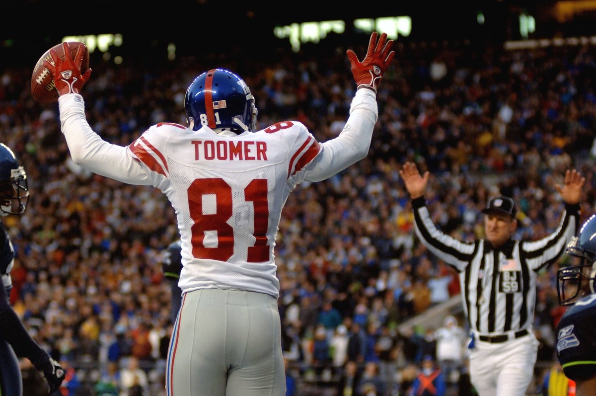  New York Giants wide receiver #81 Amani Toomer celebrates after he caught a touchdown against the Seattle Seahawks at Qwest Field. Mark J. Rebilas-USA TODAY Sports