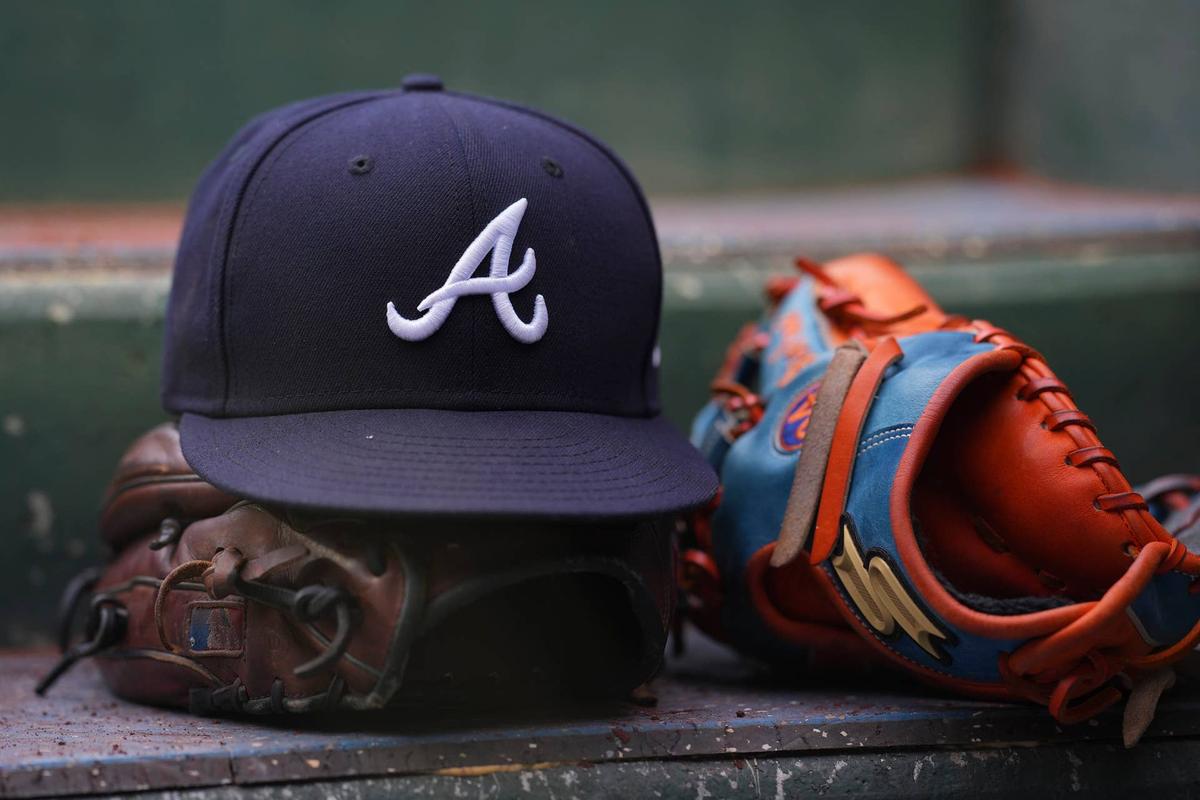  PHILADELPHIA, PA - JULY 26: A general view of gloves and an Atlanta Braves hat against the Philadelphia Phillies at Citizens Bank Park on July 26, 2022 in Philadelphia, Pennsylvania. The Braves defeated the Phillies 6-3. (Photo by Mitchell Leff/Getty Images) 