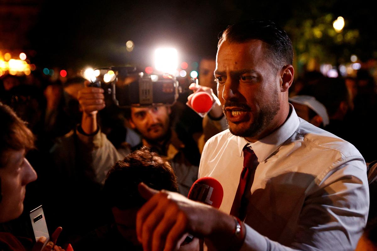 FILE PHOTO: French deputy Sebastien Delogu speaks to members of the media as people gather on the Place de Republique following the results of the European elections, in Paris, France, June 10, 2024. REUTERS/Abdul Saboor/File Photo
