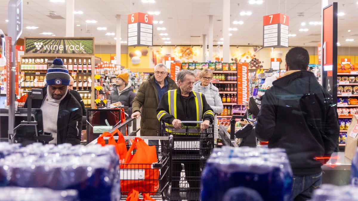 People shop in a grocery store in Mississauga, Ontario, Canada, January 26, 2026. REUTERS/Carlos Osorio