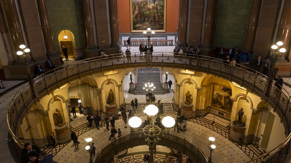 People walk through the halls of the Illinois Capitol building on Feb. 17, 2026, in Springfield, Illinois. (Brian Cassella/Chicago Tribune/TNS)