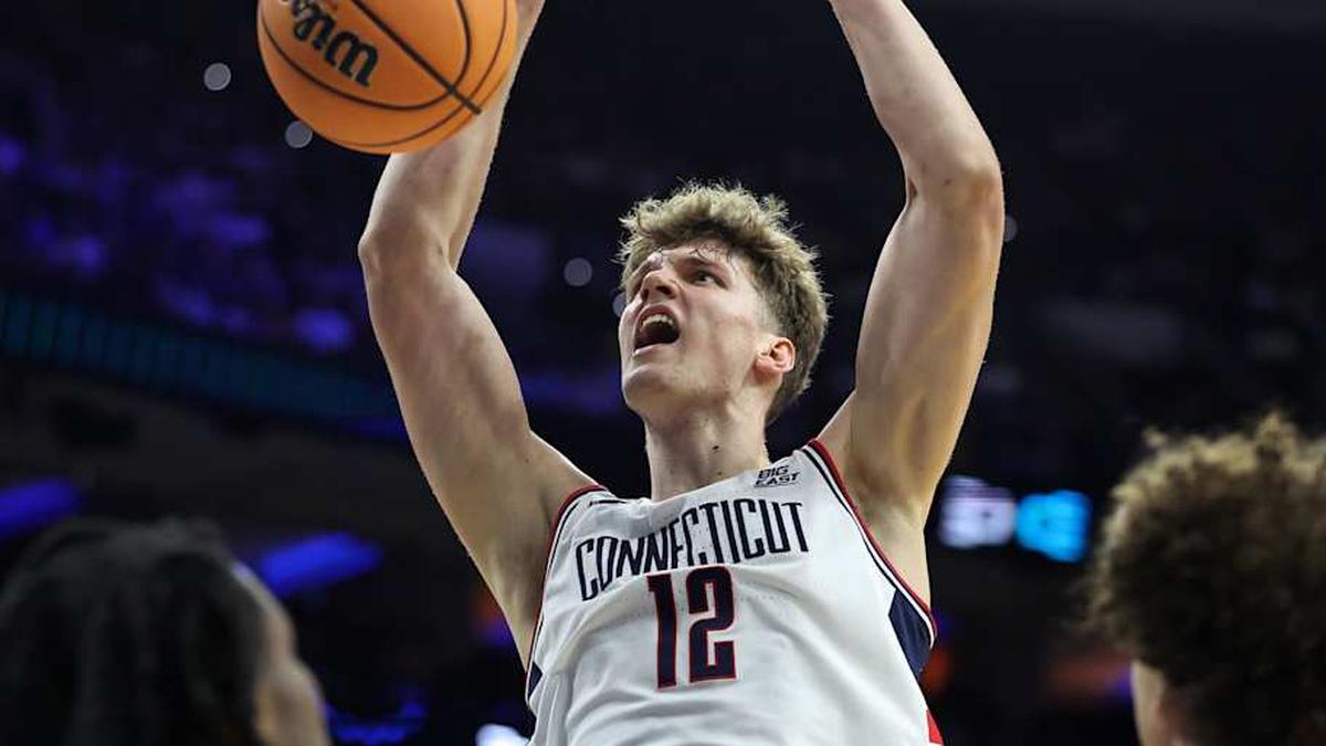  Mar 22, 2026; Philadelphia, PA, USA; UConn Huskies center Eric Reibe (12) dunks the ball against the UCLA Bruins in the first half during a second round game of the men's 2026 NCAA Tournament at Xfinity Mobile Arena. Mandatory Credit: Bill Streicher-Imagn Images | Bill Streicher-Imagn Images 