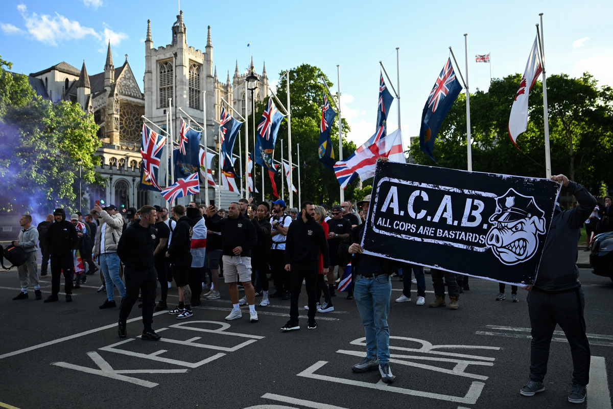 Protesters gather in Parliament Square following a knife attack in Belfast on June 8, that left a man seriously injured and prompted police to declare a critical incident, in London, Britain, June 9, 2026. REUTERS/Chris J. Ratcliffe