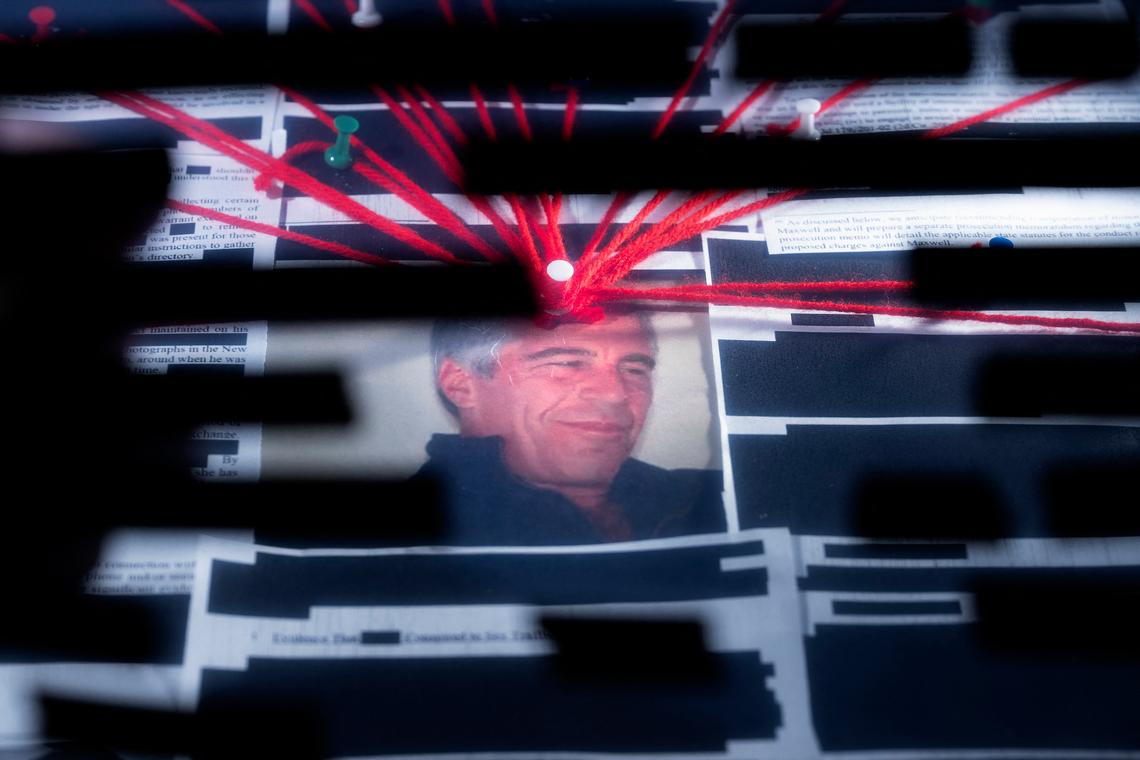  This photo illustration shows redacted documents from the Epstein files released by the DOJ on February 18, 2026. 