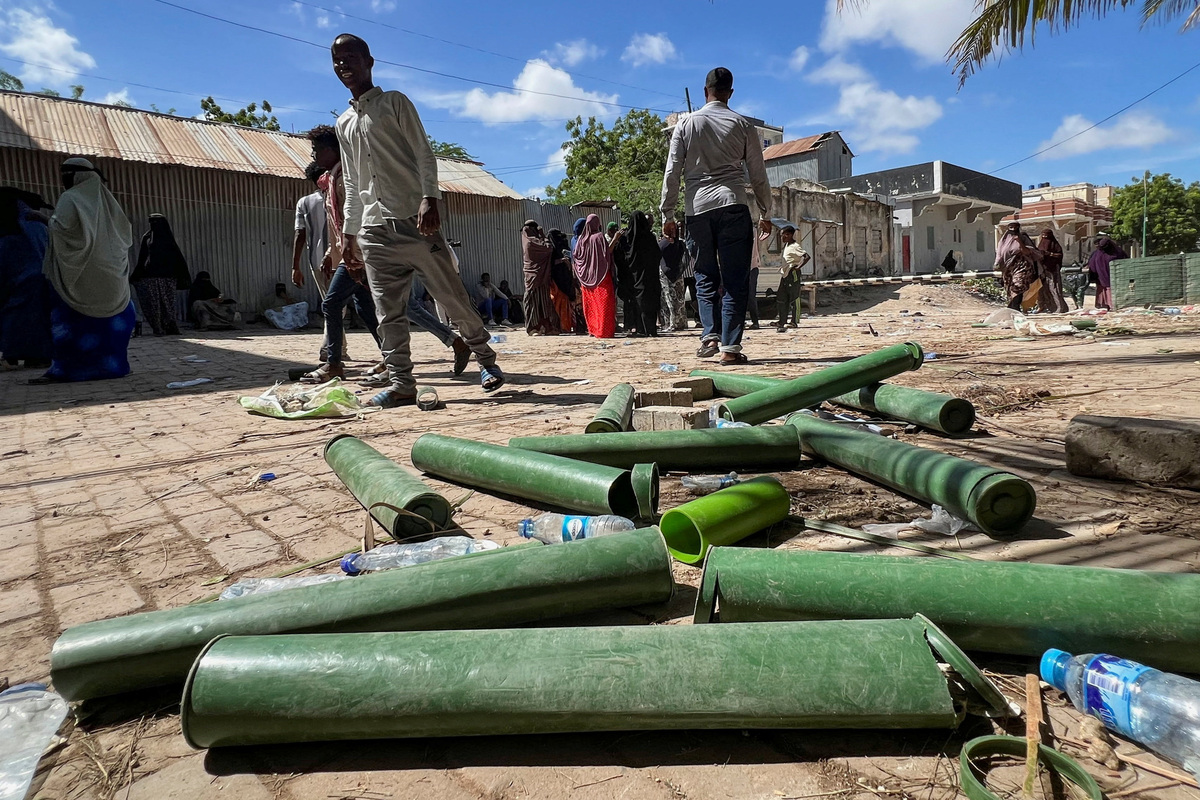 Somalis walk past littered armour as they protest against Somalia's President Hassan Sheikh Mohamud over his decision to remain in office after his term expired last month, in Mogadishu, Somalia, June 4, 2026. Picture taken with a mobile phone. REUTERS/Feisal Omar