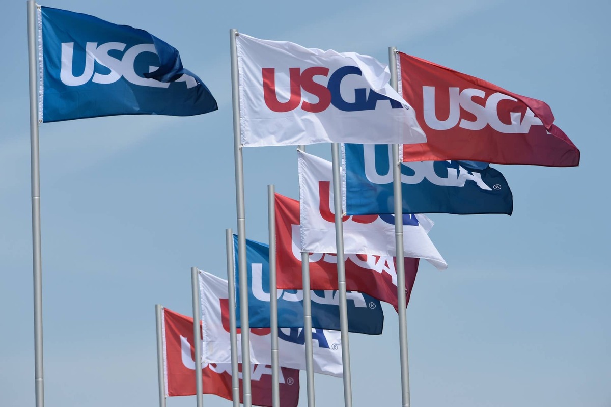  USGA flags fly at Chambers Bay during the 2015 U.S. Open practice rounds, with the governing body's golf ball rollback plan now shifting into a broader debate over distance, timing and the future of the game. Credit: Michael Madrid-USA TODAY Sports