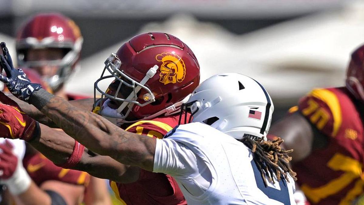  Oct 12, 2024; Los Angeles, California, USA; Penn State Nittany Lions quarterback Beau Pribula (9) breaks up a pass for USC Trojans wide receiver Kyron Hudson (10) in the first half at United Airlines Field at the Los Angeles Memorial Coliseum. Mandatory Credit: Jayne Kamin-Oncea-Imagn Images | Jayne Kamin-Oncea-Imagn Images 