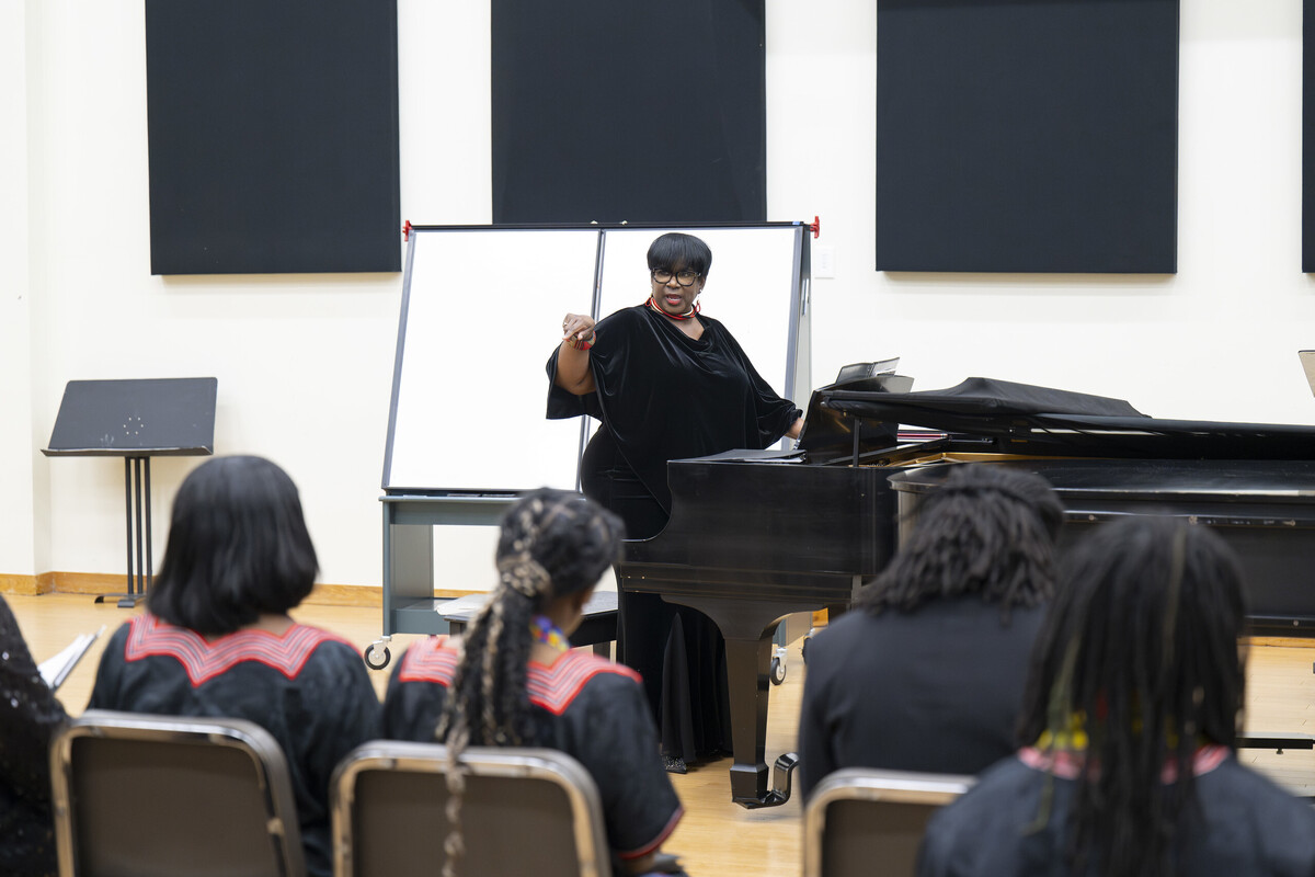  Simmons-Burke instructs the choir. (WSSU Photo)