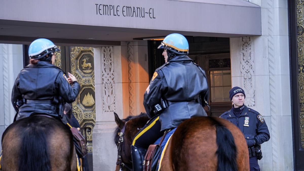 New York Police Department Officers stand guard outside of Temple Emanu-El on Feb. 28, 2026, in New York after President Donald Trump announced that the United States and Israel had launched an attack on Iran.