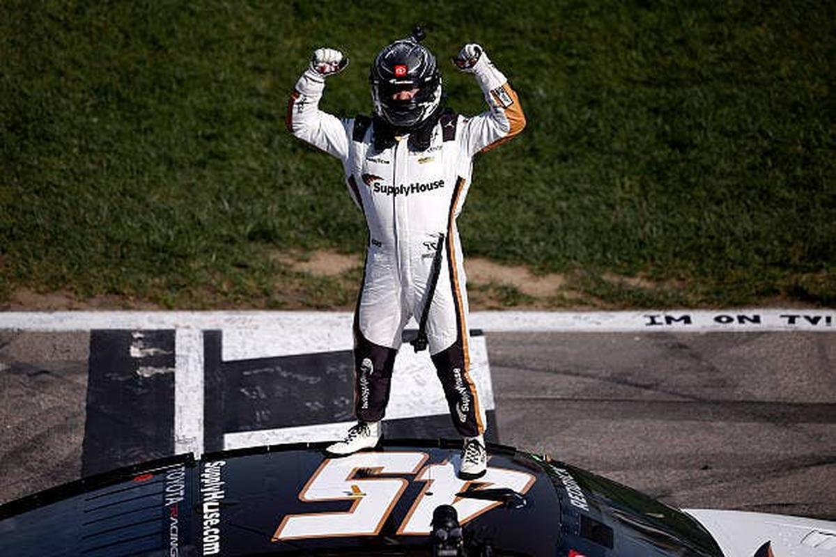  Tyler Reddick celebrates after winning the NASCAR Cup Series AdventHealth 400. (Photo by Sean Gardner/Getty Images) Photo by Sean Gardner/Getty Images