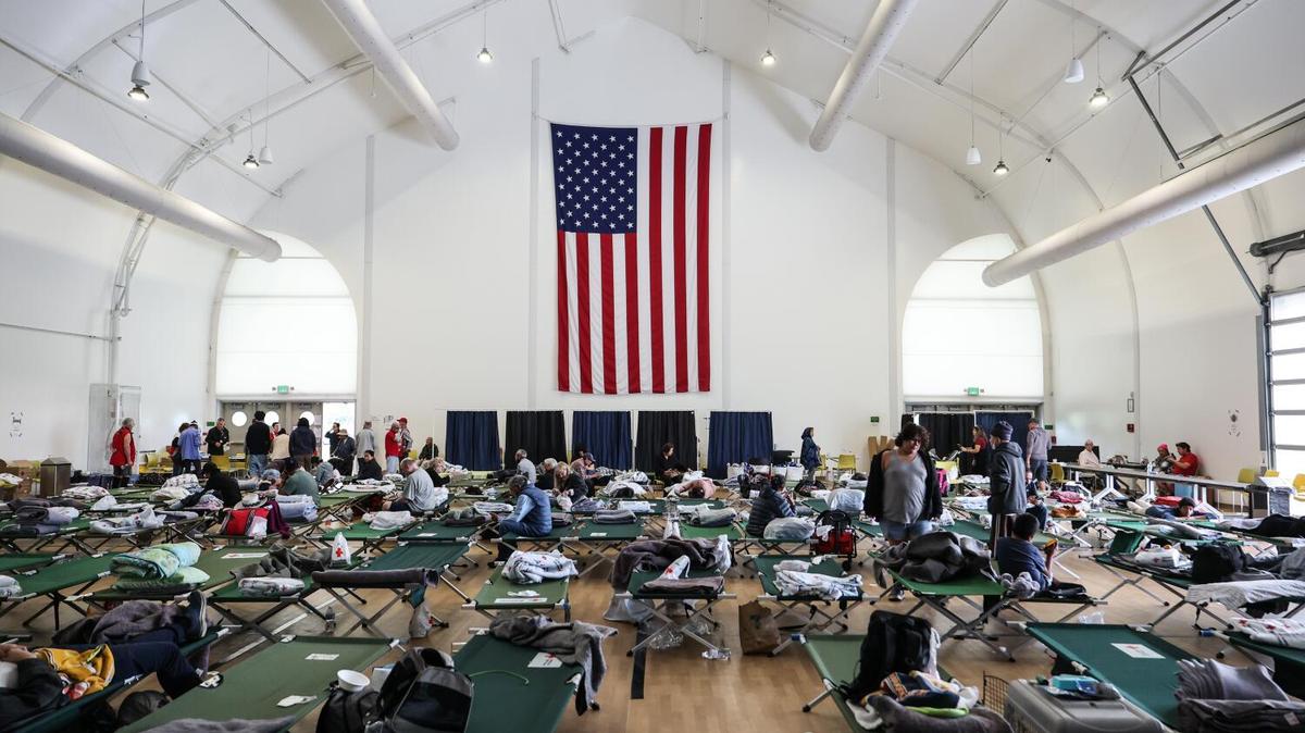 People's belongings are spread out on cots in the Freedom Hall, after taking refuge due to the Chemical Leak at GKN Aerospace Transparency building, on Saturday, May 23, 2026, in Fountain Valley, California. Tens of thousands told to evacuate after a 34,000-gallon tank of methyl methacrylate leaked at an aerospace plastics facility, sending potentially toxic vapors into the air. (Allen J. Schaben/Los Angeles Times/TNS)