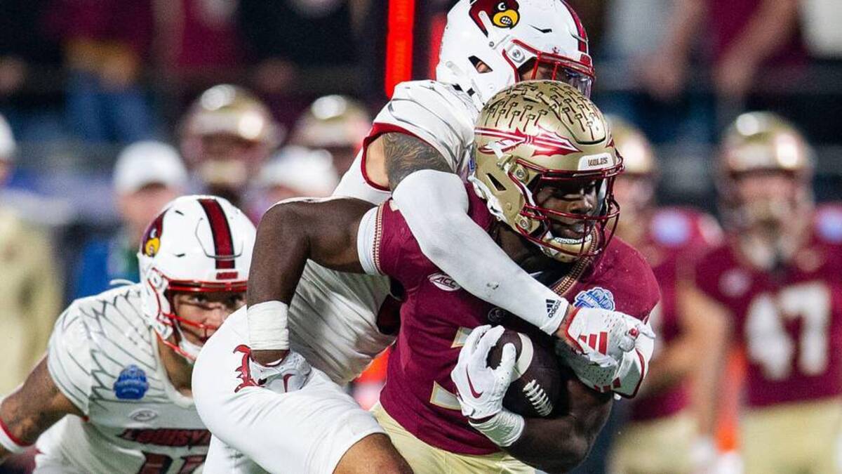  Florida State Seminoles running back Trey Benson (3) gets tackled from behind as he runs down the field. The Florida State Seminoles defeated the Louisville Cardinals 16-6 to claim the ACC Championship title in Charlotte, North Carolina on Saturday, Dec. 2, 2023. | Alicia Devine/USA Today / USA TODAY NETWORK 