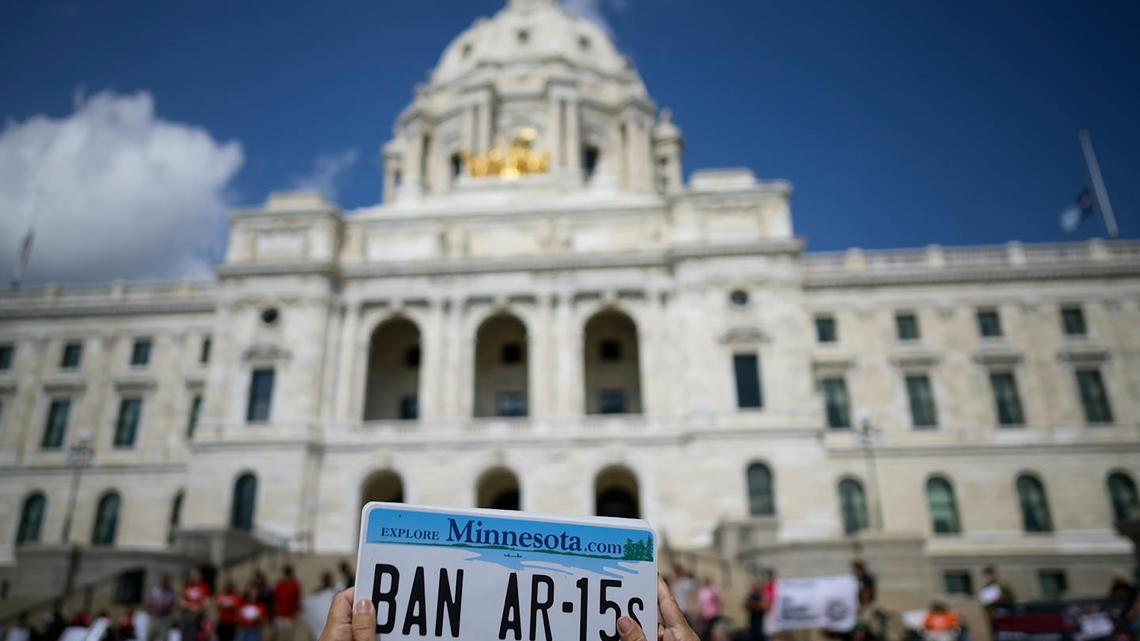 Mia Olson of Bloomington, with Moms Demand Action, holds up a sign demanding the ban of AR-15 assault rifles during a rally calling for action on gun-violence prevention to honor the victims of the mass shooting at Annunciation Catholic Church and School on Sept. 1, 2025, at the Minnesota State Capitol. (Aaron Lavinsky/The Minnesota Star Tribune/TNS)