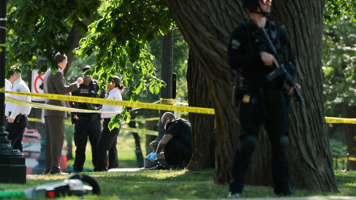 A U.S. Secret Service crime scene investigator works at the scene of an officer-involved shooting in Washington, D.C., U.S., May 4, 2026. REUTERS/Jonathan Ernst