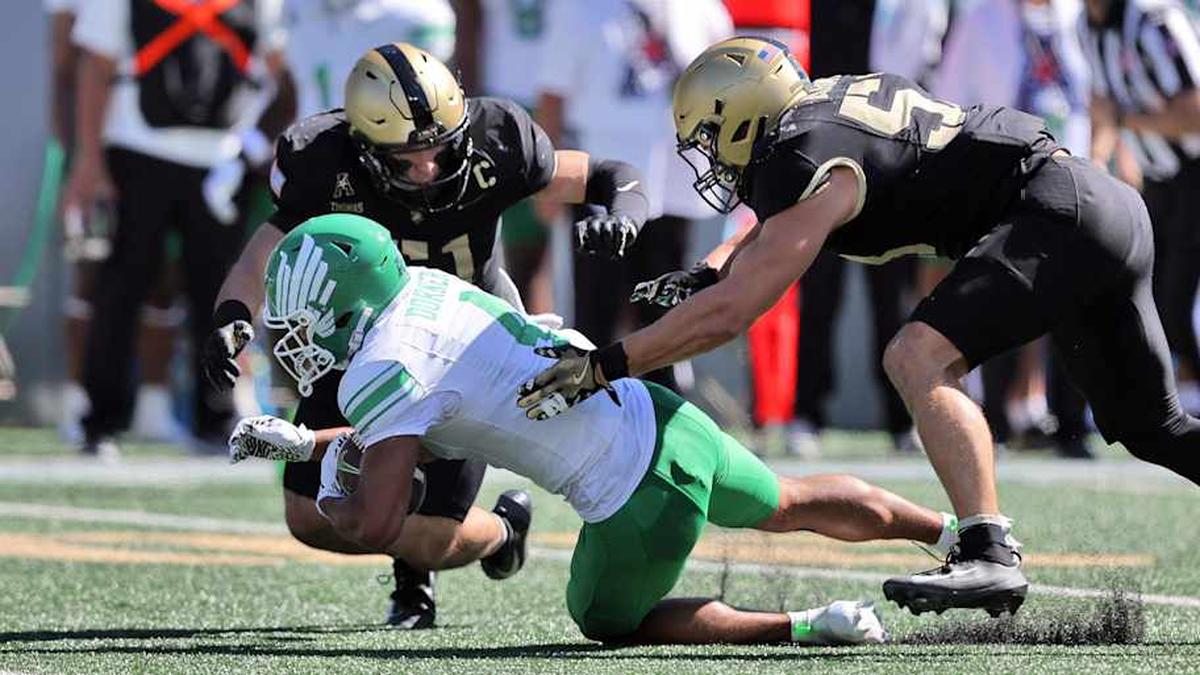  Sep 20, 2025; West Point, New York, USA; North Texas Mean Green wide receiver Cameron Dorner (4) is tackled by Army Black Knights linebacker Andon Thomas (51) during the first half at Michie Stadium. Mandatory Credit: Danny Wild-Imagn Images | Danny Wild-Imagn Images 