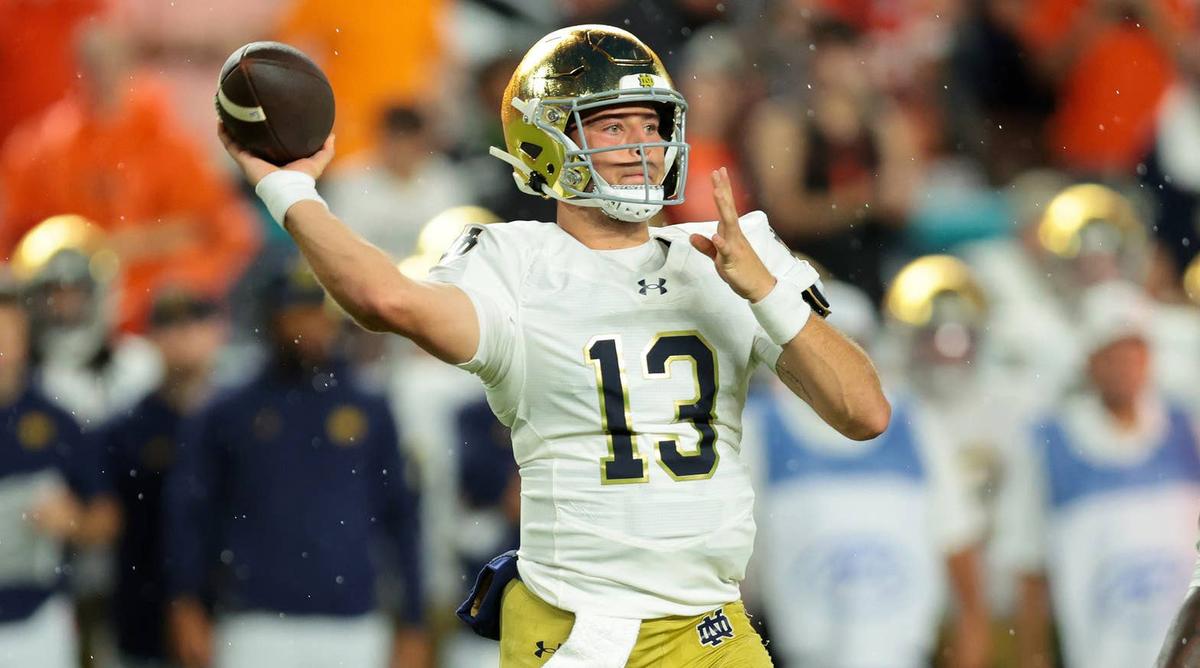  Aug 31, 2025; Miami Gardens, Florida, USA; Notre Dame Fighting Irish quarterback CJ Carr (13) drops back to pass against the Miami Hurricanes during the first quarter at Hard Rock Stadium. Mandatory Credit: Sam Navarro-Imagn Images © Sam Navarro-Imagn Images
