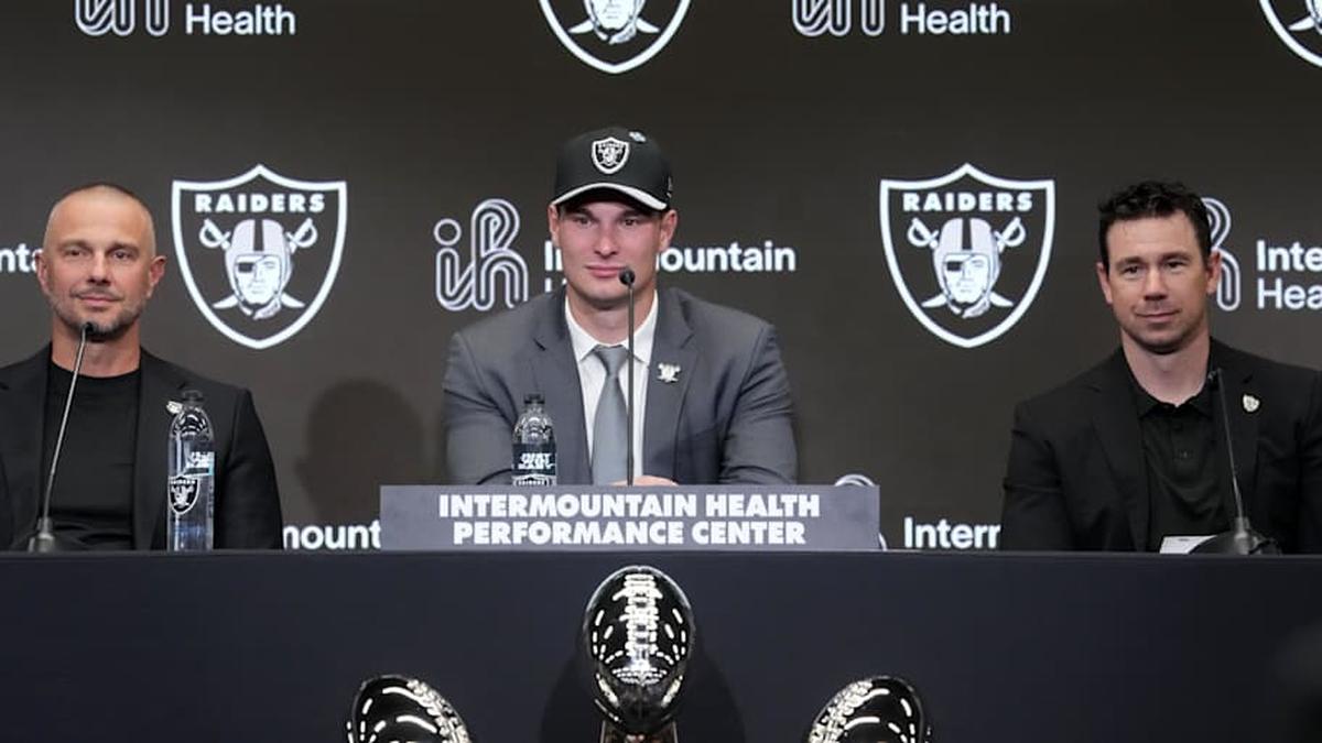  Apr 24, 2026; Henderson, NV, USA; Las Vegas Raiders quarterback Fernando Mendoza (center) speaks at introductory press conference at Intermountain Health Performance Center flanked by general manager John Spytek (left) and head coach Klint Kubiak after being selected as the No. 1 pick in the 2026 NFL Draft. Mandatory Credit: Kirby Lee-Imagn Images | Kirby Lee-Imagn Images 