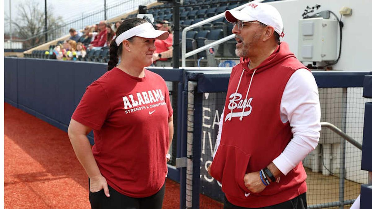  Michelle Diltz and Patrick Murphy talk before a game | UA Athletics 