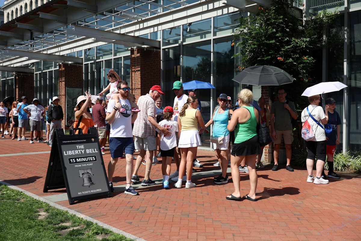 People wait in line to view the Liberty Bell at Independence National Historical Park amid a heatwave in Philadelphia, Pennsylvania, U.S., July 2, 2026.  REUTERS/Hannah Beier