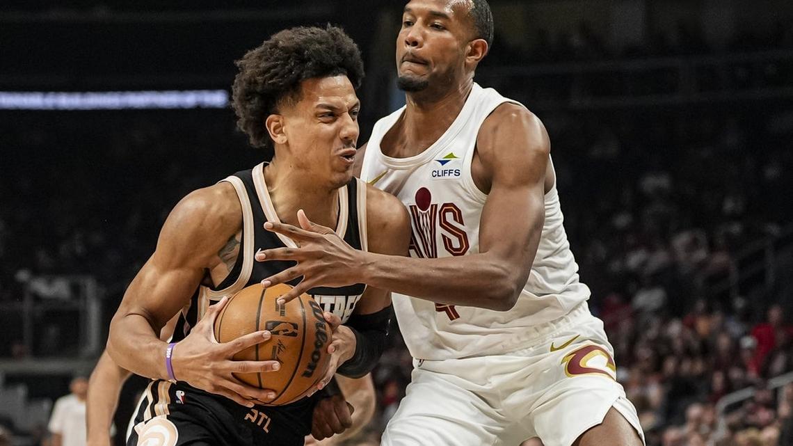 Hawks clinch playoff spot while walloping Cavs