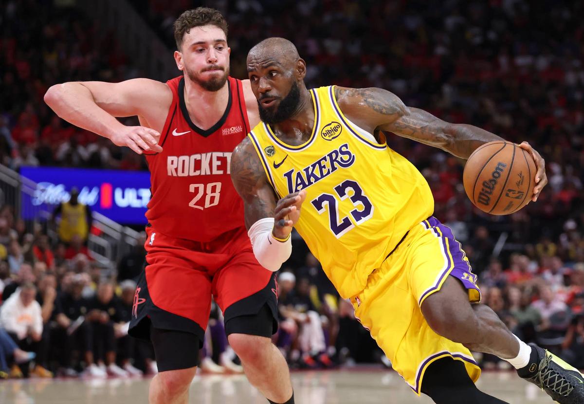  Apr 24, 2026; Houston, Texas, USA; Los Angeles Lakers forward LeBron James (23) drives with the ball as Houston Rockets center Alperen Sengun (28) defends during the fourth quarter during game three of the first round of the 2026 NBA Playoffs at Toyota Center. Mandatory Credit: Troy Taormina-Imagn Images 