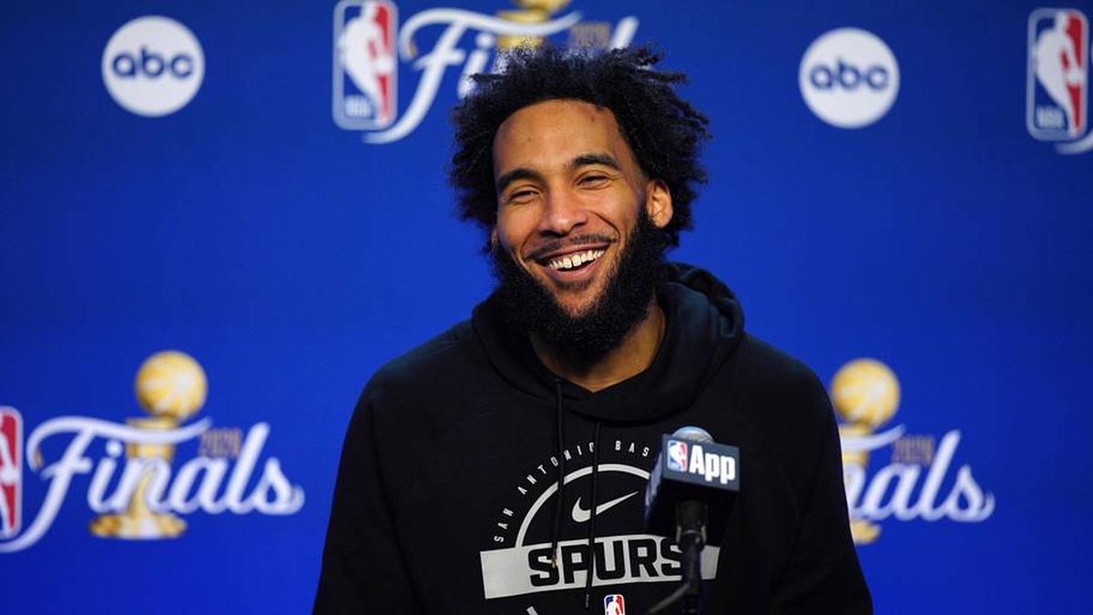 Jun 2, 2026; San Antonio, TX, USA; San Antonio Spurs forward Julian Champagnie (30) talks to press during the NBA finals media day at Frost Bank Center. | Dustin Safranek-Imagn Images 
