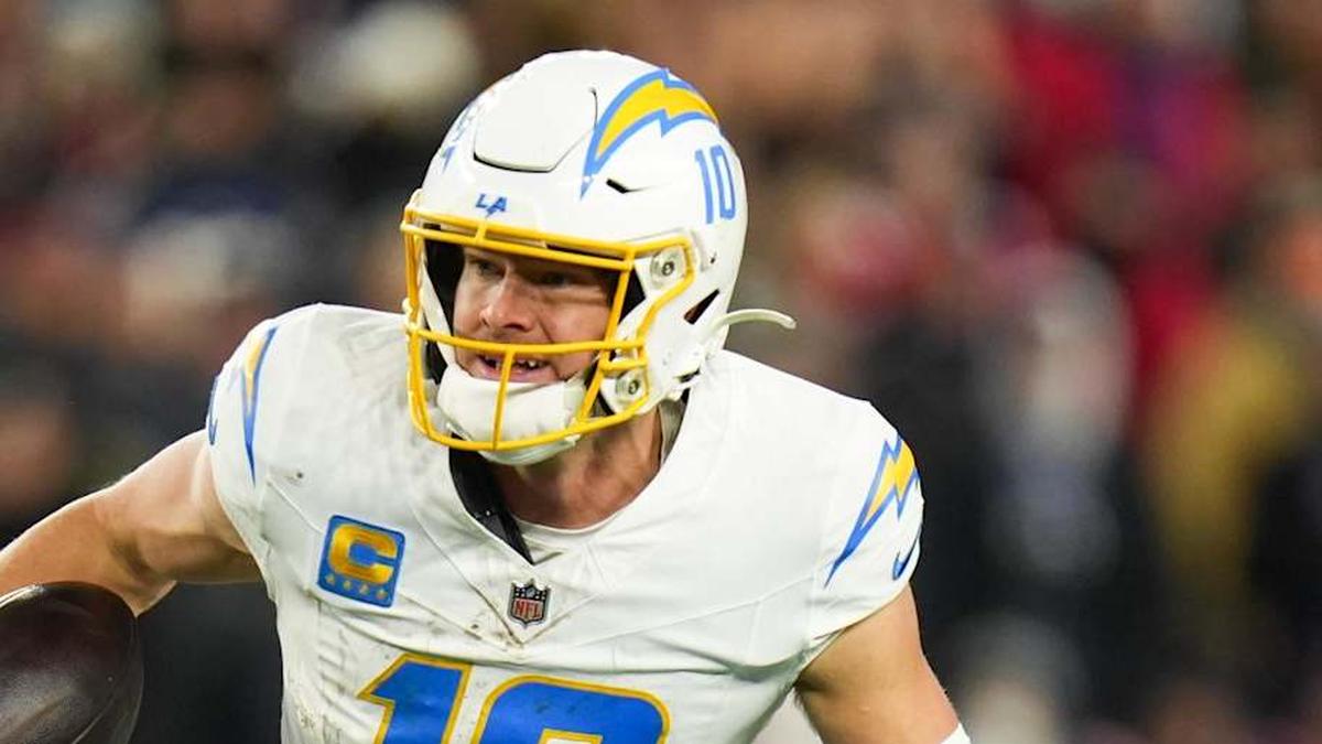  Jan 11, 2026; Foxborough, MA, USA; Los Angeles Chargers quarterback Justin Herbert (10) scrambles during the fourth quarter against the New England Patriots in an AFC Wild Card Round game at Gillette Stadium. Mandatory Credit: David Butler II-Imagn Images | David Butler II-Imagn Images 