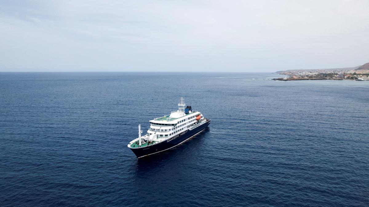 FILE PHOTO: A drone view of the cruise ship MV Hondius, carrying passengers suspected of having cases of hantavirus on board, as it prepares to leave Praia, Cape Verde, May 6, 2026. REUTERS/Danilson Sequeira/File Photo