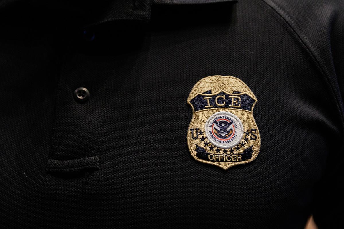FILE PHOTO: The badge of a U.S. Immigration and Customs Enforcement (ICE) is embroidered on a polo shirt of an ICE employee in Arlington, Texas, U.S. August 26, 2025.  REUTERS/Shelby Tauber/File Photo