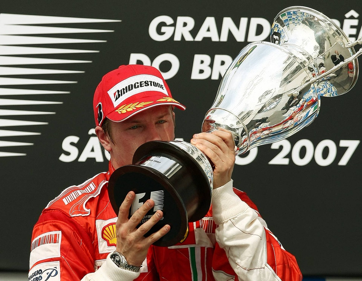  Kimi Raikkonen kisses his trophy during the podium ceremony of the 2007 F1 Brazilian Grand Prix. Photo by VANDERLEI ALMEIDA / AFP via Getty Images