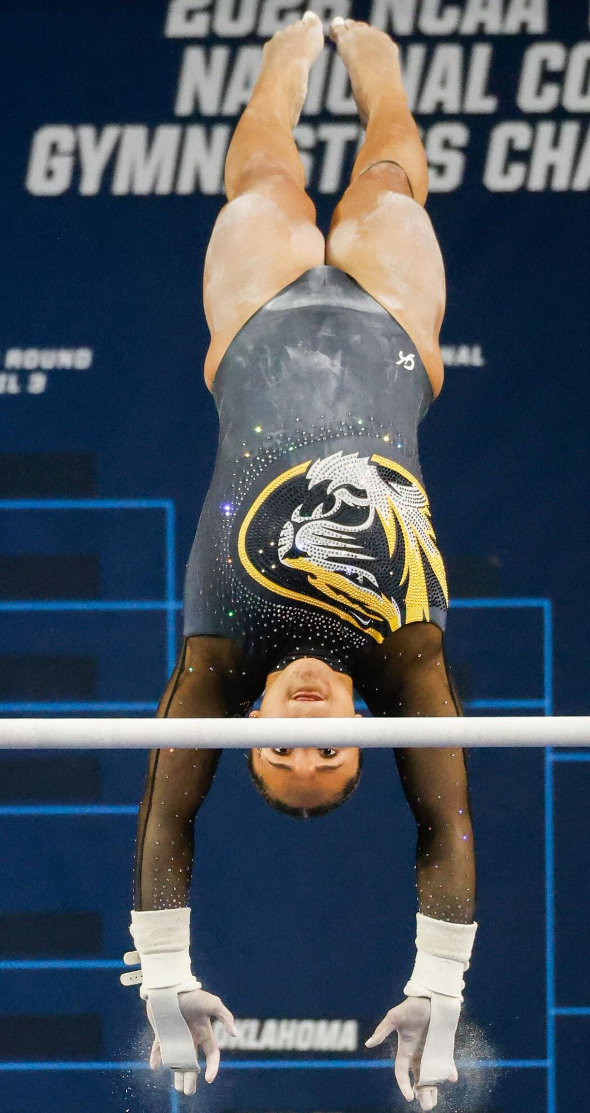 Makayla Green does a maloney on the bars at the NCAA Lexington Regional Finals on Sunday at the Historic Memorial Coliseum, in Lexington, Ky. The Tigers earned a 49.300 on bars.