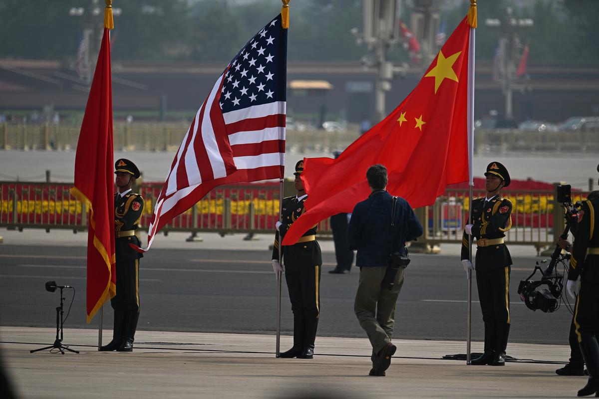 American and Chinese flags are displayed at the Great Hall of the People in Beijing on Thursday, May 14, 2026, during President Donald Trump's visit to China for a two-day summit with China's leader, Xi Jinping. (Kenny Holston/The New York Times)