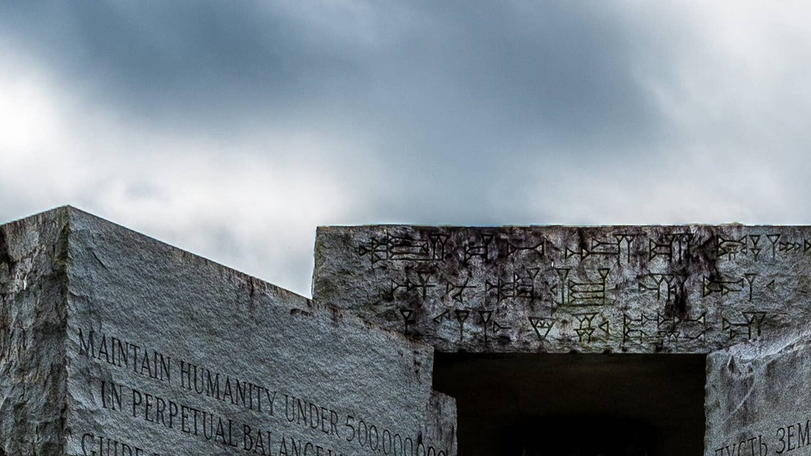 In 1980, a Georgia granite company built a 19-foot monument carved with ten guidelines in eight languages; a bomb hit it on July 6, 2022, and authorities took the rest down with a backhoe 