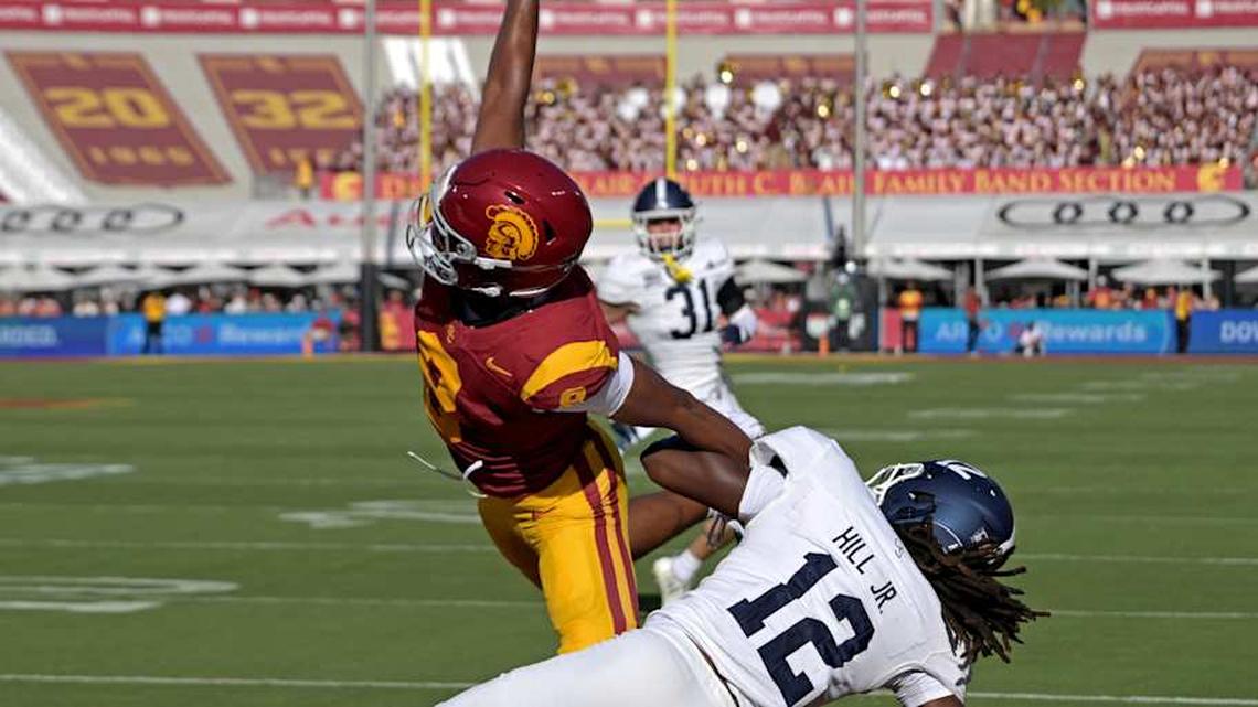  Sep 6, 2025; Los Angeles, California, USA; USC Trojans wide receiver Ja'Kobi Lane (8) makes a one handed catch for a touchdown as he is defended by Georgia Southern Eagles defensive back Tracy Hill Jr. (12) during the first quarter at United Airlines Field at Los Angeles Memorial Coliseum. Mandatory Credit: Jayne Kamin-Oncea-Imagn Images | Jayne Kamin-Oncea-Imagn Images 