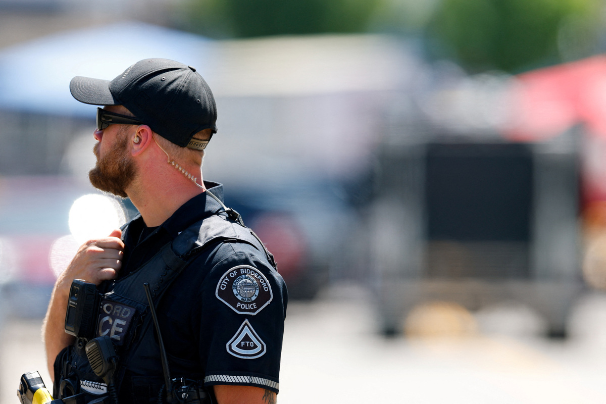 A police officer works at a scene of a shooting involving U.S. Immigration and Customs Enforcement (ICE) in Biddeford, Maine, U.S. July 13, 2026.  REUTERS/CJ Gunther