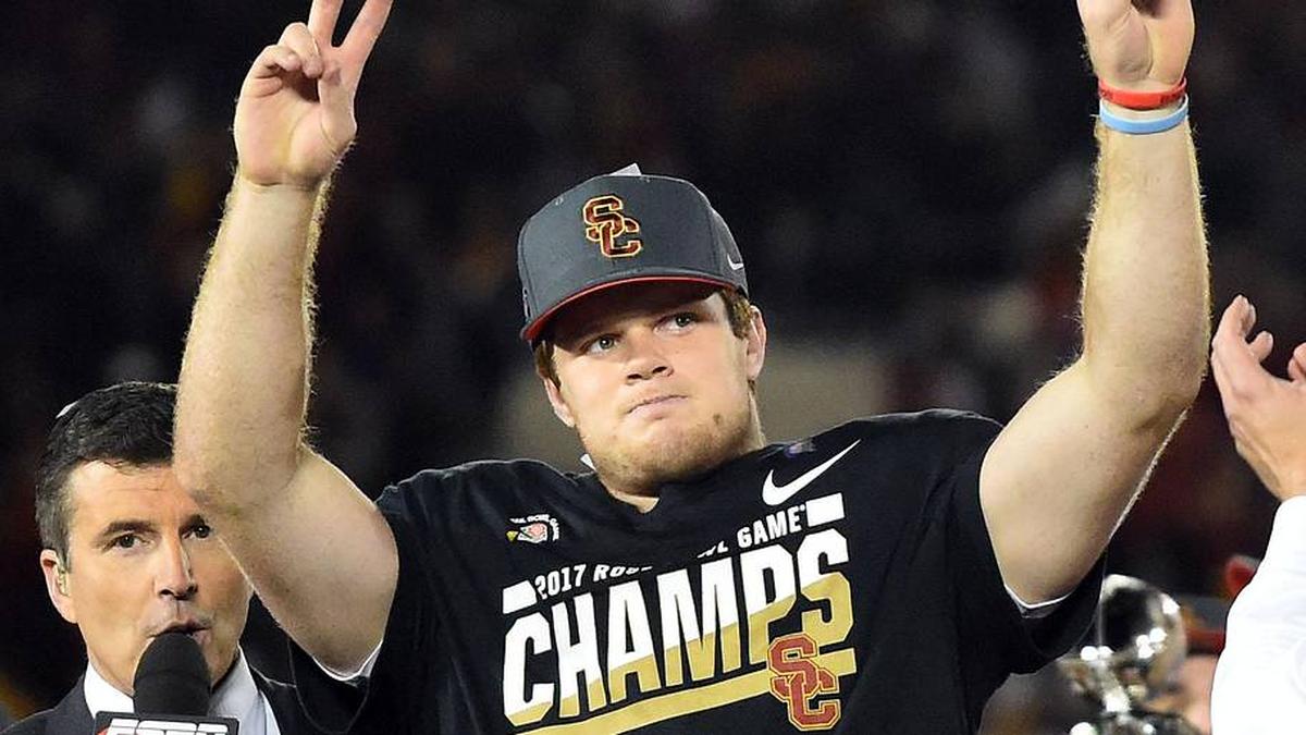  Jan 2, 2017; Pasadena, CA, USA; USC Trojans quarterback Sam Darnold (14) celebrates on the podium after defeating the Penn State Nittany Lions in the 2017 Rose Bowl game at Rose Bowl. Mandatory Credit: Jayne Kamin-Oncea-Imagn Images | Jayne Kamin-Oncea-Imagn Images 