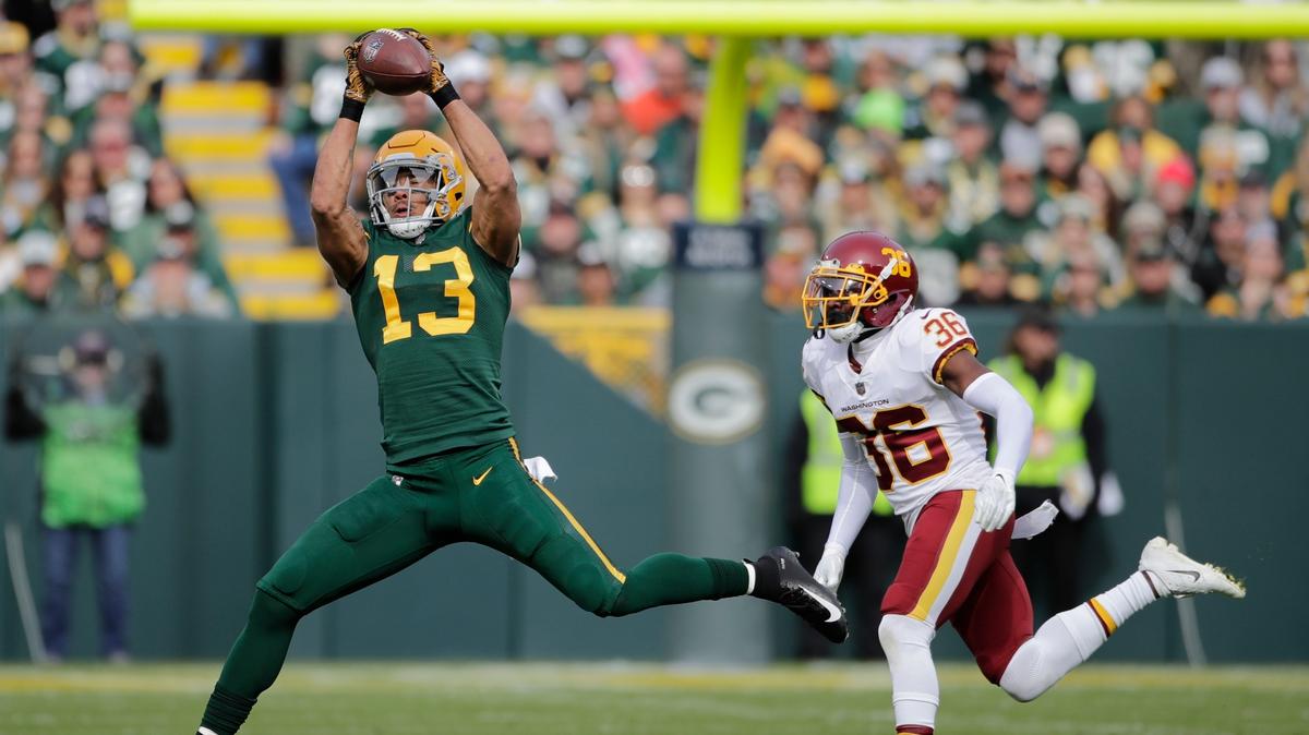 Green Bay Packers’ Allen Lazard catches a pass in front of Washington Football Team’s Danny Johnson during the first half of an NFL football game Sunday, Oct. 24, 2021, in Green Bay, Wis. (AP Photo/Aaron Gash)