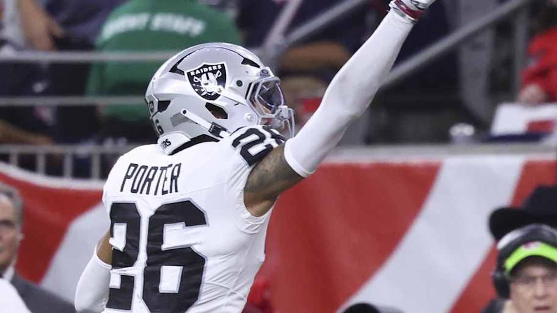  Dec 21, 2025; Houston, Texas, USA; Houston Texans wide receiver Nico Collins (12) makes a recption as Las Vegas Raiders cornerback Darien Porter (26) and safety Isaiah Pola-Mao (20) defend during the fourth quarter at NRG Stadium. Mandatory Credit: Troy Taormina-Imagn Images | Troy Taormina-Imagn Images 