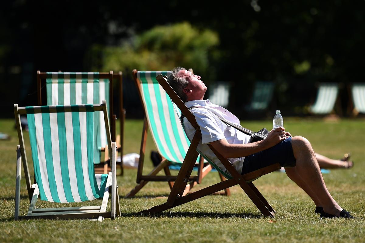  A man resting in a deck chair in central London during a heatwave in July 2014. 