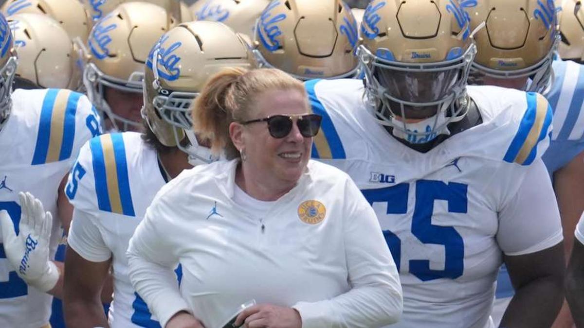  May 2, 2026; Pasadena, CA, USA; UCLA Bruins coach Bob Chesney and women's basketball coach Cori Close lead players onto the field during the spring game at Rose Bowl. Mandatory Credit: Kirby Lee-Imagn Images | Kirby Lee-Imagn Images 