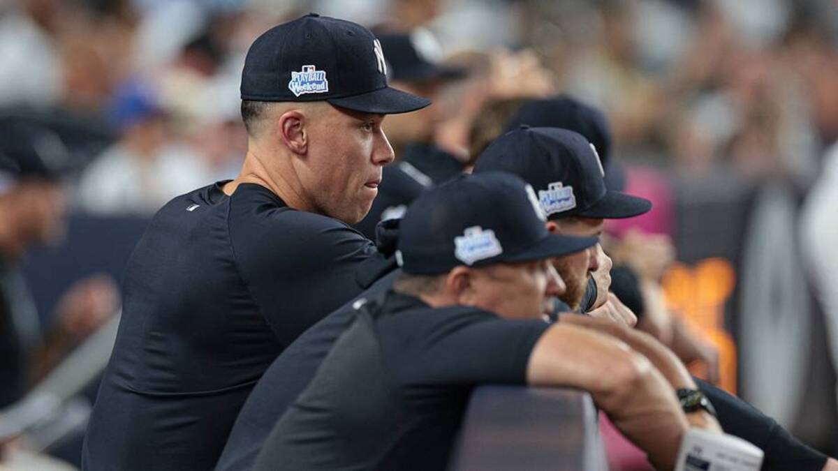  New York Yankees right fielder Aaron Judge (99) looks out from the dugout during the eighth inning against the Boston Red Sox at Yankee Stadium. | IMAGN IMAGES via Reuters Connect 