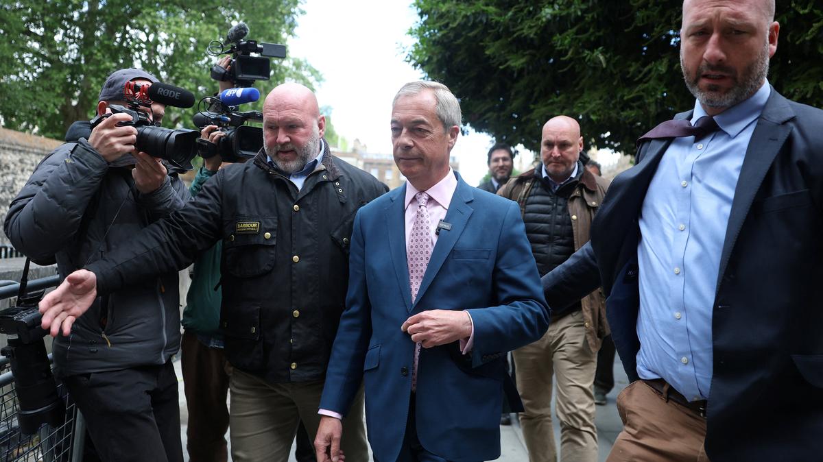Britain's Reform UK leader Nigel Farage walks following a photocall near the Houses of Parliament, ahead of upcoming local and mayoral elections in England and devolved parliamentary elections in Scotland and Wales on May 7, in London, Britain, May 6, 2026. REUTERS/Toby Melville